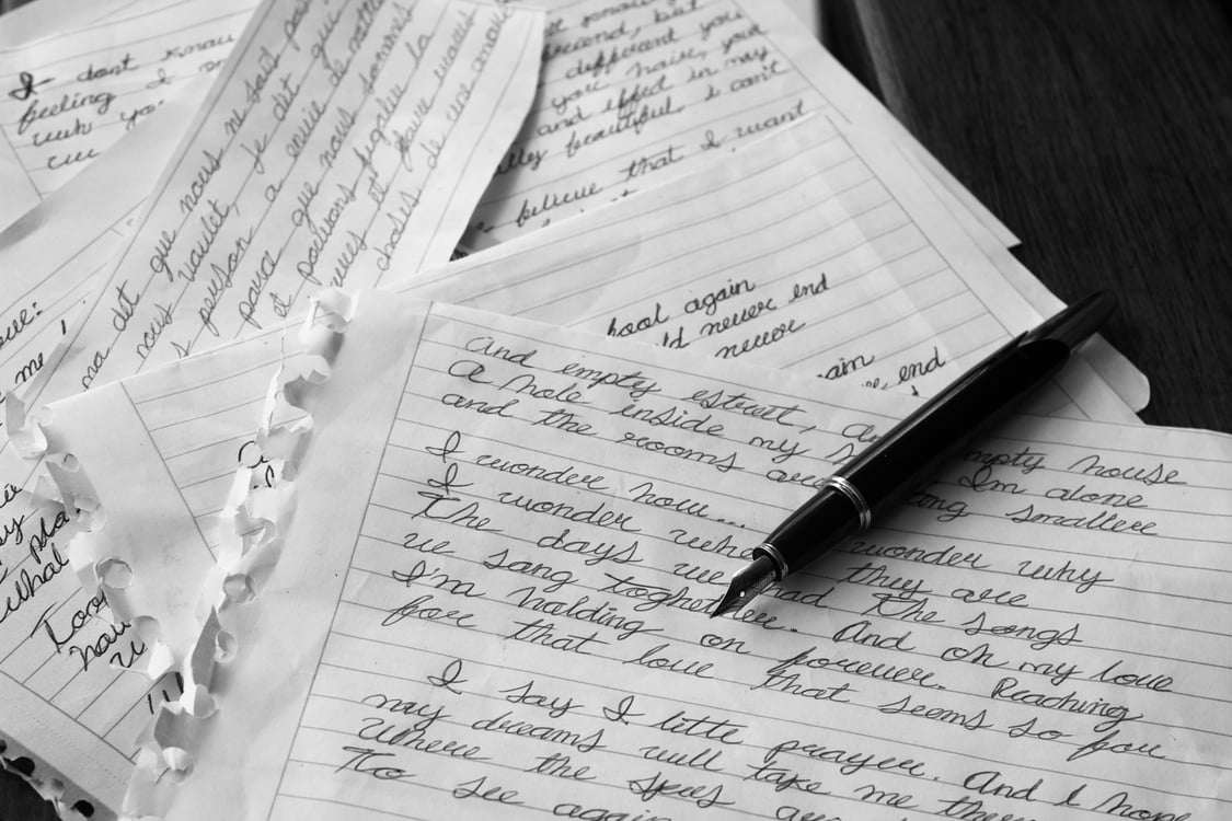 Pen on a handwritten page. Photo by Ire Photocreative on Unsplash.